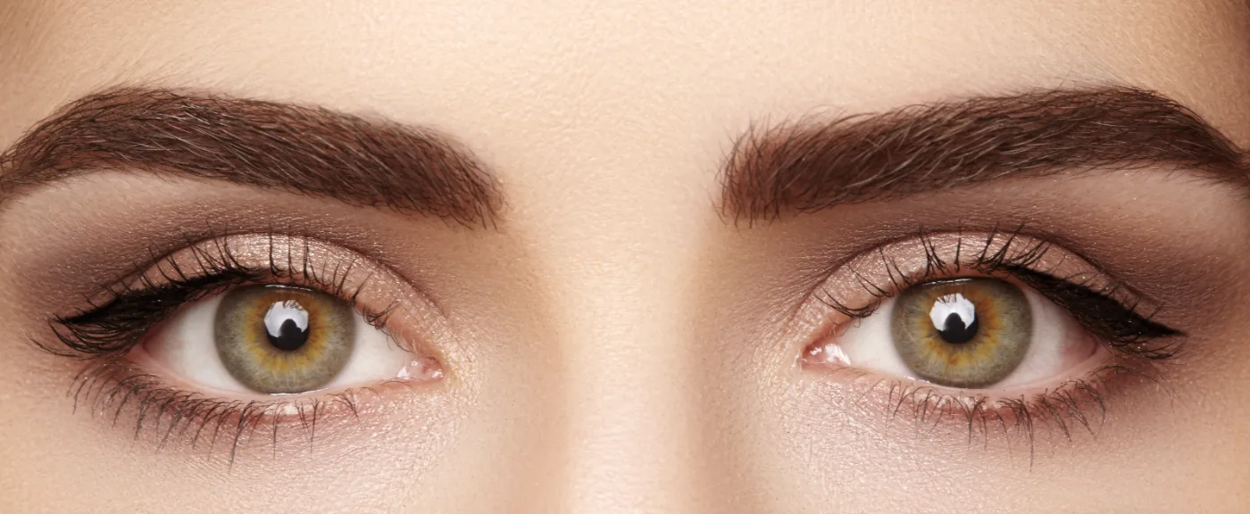 Long, full, dark lashes and defined brows after Latisse